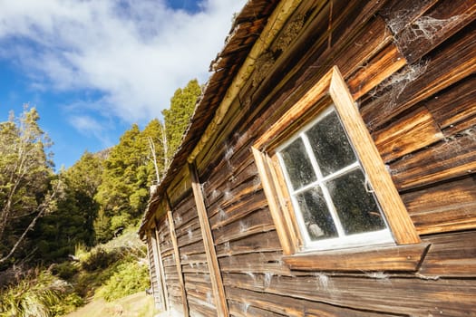 Iconic Du Cane Hut built by Patrick Joseph ‘Paddy’ Hartnett on the Overland Track is the oldest structure in the area. Photographed on a warm autumn morning in Cradle Mountain, Tasmania, Australia