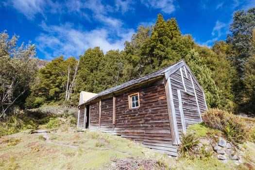 Iconic Du Cane Hut built by Patrick Joseph ‘Paddy’ Hartnett on the Overland Track is the oldest structure in the area. Photographed on a warm autumn morning in Cradle Mountain, Tasmania, Australia