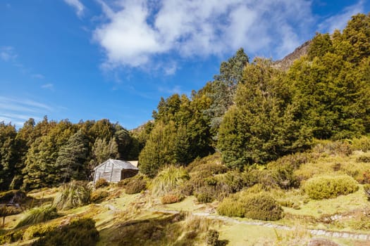 Iconic Du Cane Hut built by Patrick Joseph ‘Paddy’ Hartnett on the Overland Track is the oldest structure in the area. Photographed on a warm autumn morning in Cradle Mountain, Tasmania, Australia