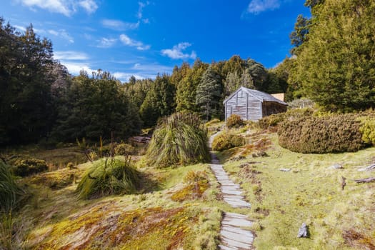 Iconic Du Cane Hut built by Patrick Joseph ‘Paddy’ Hartnett on the Overland Track is the oldest structure in the area. Photographed on a warm autumn morning in Cradle Mountain, Tasmania, Australia