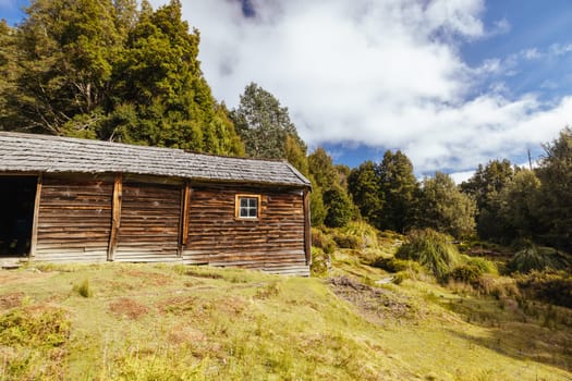 Iconic Du Cane Hut built by Patrick Joseph ‘Paddy’ Hartnett on the Overland Track is the oldest structure in the area. Photographed on a warm autumn morning in Cradle Mountain, Tasmania, Australia