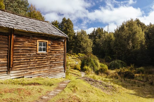 Iconic Du Cane Hut built by Patrick Joseph ‘Paddy’ Hartnett on the Overland Track is the oldest structure in the area. Photographed on a warm autumn morning in Cradle Mountain, Tasmania, Australia