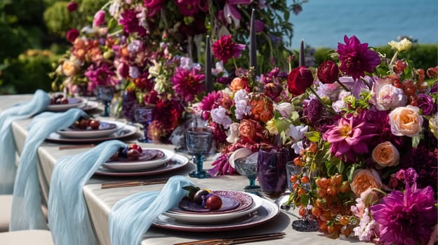 Elegant coastal table setting with floral arrangements, fine tableware, and scenic ocean views, perfect for a wedding or sophisticated event