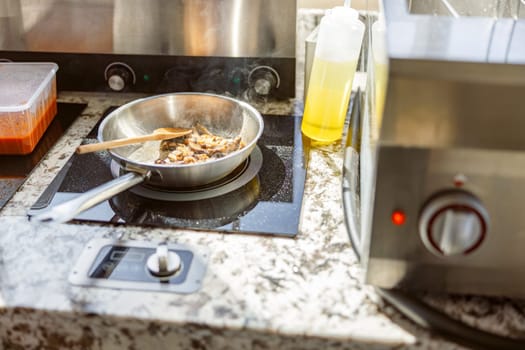 A stylish kitchen scene with a frying pan, fresh ingredients, and essential tools for culinary delights