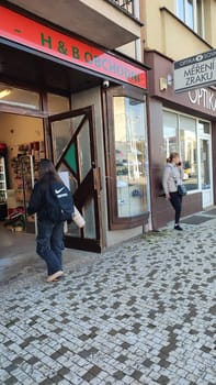 October 22 2024 Hradec Kralove, Czech Republic Europe, Kralov region, Kralovehradecky kraj, Storefront entrance pavement. High quality photo editorial people travel shop shopping city