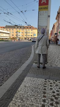 October 22 2024 Hradec Kralove, Czech Republic Europe, Kralov region, Kralovehradecky kraj, Person waiting street building architecture street . High quality photo people city town transport editorial building