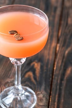 Coffee syrup and guava unite with rum, garnished by floating coffee beans