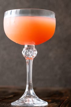 Coffee syrup and guava unite with rum, garnished by floating coffee beans
