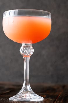 Coffee syrup and guava unite with rum, garnished by floating coffee beans