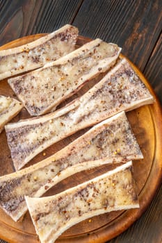 Halved bones baked to golden perfection, textures glisten with flavorful meaty depth