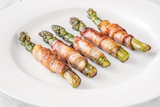 Golden bacon crisps around tender asparagus spears, savory and satisfying combination
