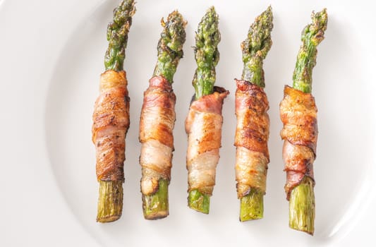 Golden bacon crisps around tender asparagus spears, savory and satisfying combination