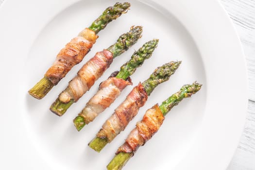 Golden bacon crisps around tender asparagus spears, savory and satisfying combination