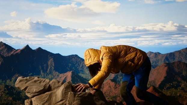 Inexperienced trekker loses his footing in extreme conditions, struggling to keep his balance as he tumbles. Remote wilderness offers beauty but also grave risks, reckless. Camera B.