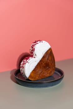 Valentine's Day Birthday holiday present gift idea Delightful and vibrant heartshaped pastry croissant treat, beautifully topped with colorful frosting galore. Copy space. Food experimentation viral dessert creative baking trend