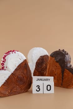 Calendar date 30 January national croissant day greeting card Delicious fresh croissant topped with colorful flavor Ganache. Creation unique heart shape bakery. Puff pastry holiday love gift present idea. Copy space