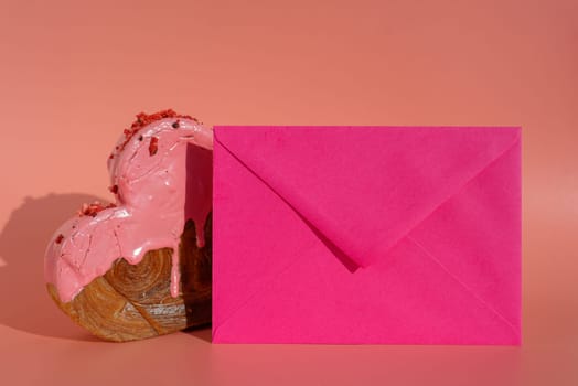 Empty sample template paper note greeting card Delicious fresh croissant topped with colorful flavor Ganache. Creation unique heart shape bakery. Puff pastry holiday love gift present idea Valentine's day. Copy space