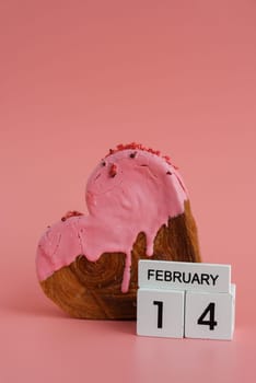 14 February calendar date Delicious fresh croissant topped with colorful flavor Ganache. Creation unique heart shape bakery. Puff pastry holiday love gift present idea Valentine's day. Copy space