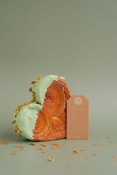 Delightful and vibrant heartshaped pastry croissant treat, beautifully topped with colorful frosting nut galore. Mock up template copy space paper note. Food experimentation viral dessert creative baking trend