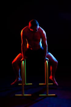Portrait, happy man and bodybuilder with abs on a studio background, backdrop and topless pride