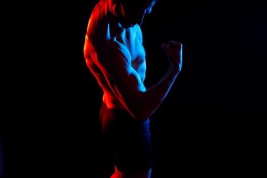 Portrait, happy man and bodybuilder with abs on a studio background, backdrop and topless pride