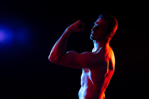 Portrait, happy man and bodybuilder with abs on a studio background, backdrop and topless pride