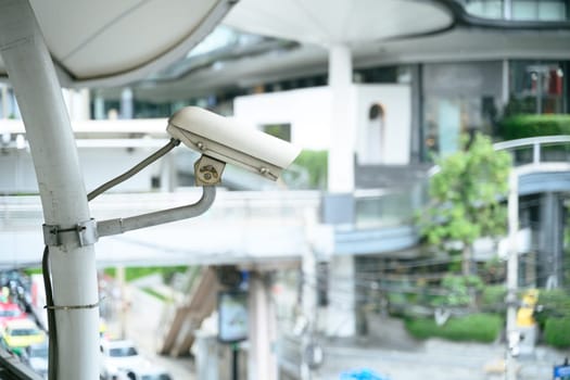 Close up of a CCTV security camera overlooking urban area.