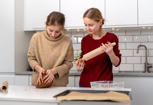 Little Sisters Making Dough For Gingerbread Cookies
