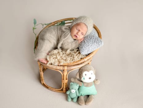 Newborn Baby Sleeping With A Smile In A Studio Photo