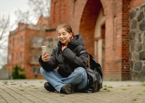 Girl In A European City Talking On A Video Call