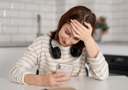 Teen Girl Wearing Headphones At Home