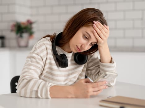 Teen Girl Wearing Headphones At Home