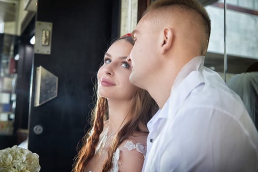 Groom and bride enjoying a cherished moment while celebrating their wedding registration together in a cozy setting.