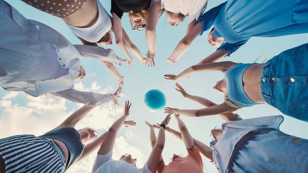 Students striving for a globe, representing global citizenship, environmental consciousness, and international collaboration for a sustainable tomorrow