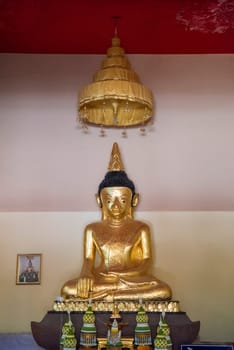 Buddha inside of Wat Phrathat Kham Kaen in the Province of Khon Kaen in Thailand. Thailand, Khon Kaen, December, 8, 2024