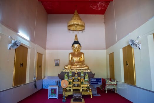 Buddha inside of Wat Phrathat Kham Kaen in the Province of Khon Kaen in Thailand. Thailand, Khon Kaen, December, 8, 2024