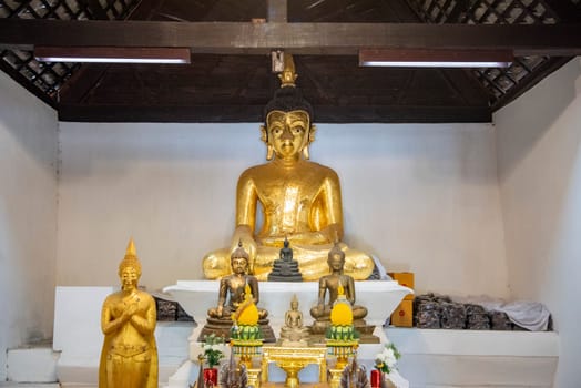 Buddha inside of Wat Phrathat Kham Kaen in the Province of Khon Kaen in Thailand. Thailand, Khon Kaen, December, 8, 2024