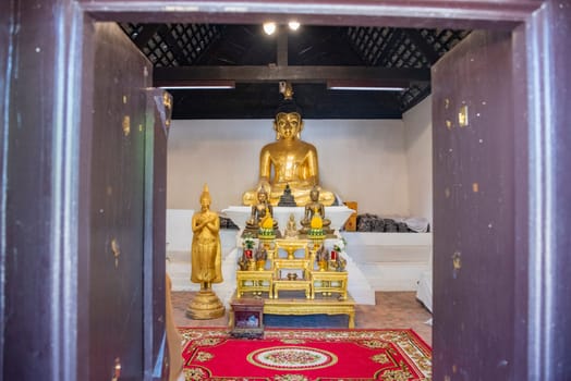 Buddha inside of Wat Phrathat Kham Kaen in the Province of Khon Kaen in Thailand. Thailand, Khon Kaen, December, 8, 2024