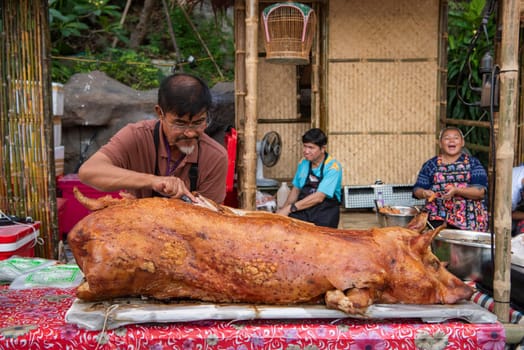 Pork meat at Thai Food Market on Wat Saket Festival Fair in Bangkok in Thailand.  Thailand, Bangkok, November, 8, 2024.