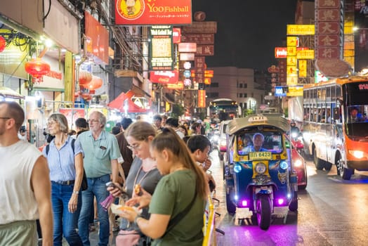People and Taxi at Marketstreet on Yaowarat Road in Chinatown in City of Bangkok in Thailand.  Thailand, Bangkok, November, 4, 2024.