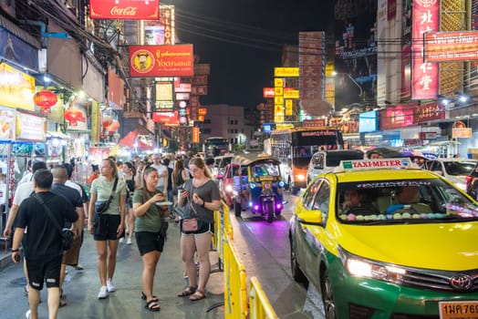 People and Taxi at Marketstreet on Yaowarat Road in Chinatown in City of Bangkok in Thailand.  Thailand, Bangkok, November, 4, 2024.