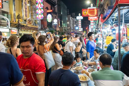 People at Night Streetmarket on Yaowarat Road in Chinatown in City of Bangkok in Thailand.  Thailand, Bangkok, November, 8, 2024.