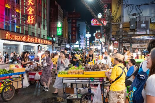 People and shops at Night Streetmarket on Yaowarat Road in Chinatown in City of Bangkok in Thailand.  Thailand, Bangkok, November, 4, 2024.