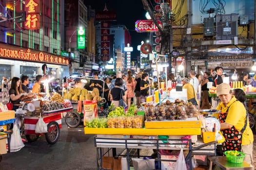 People and shops at Night Streetmarket on Yaowarat Road in Chinatown in City of Bangkok in Thailand.  Thailand, Bangkok, November, 4, 2024.