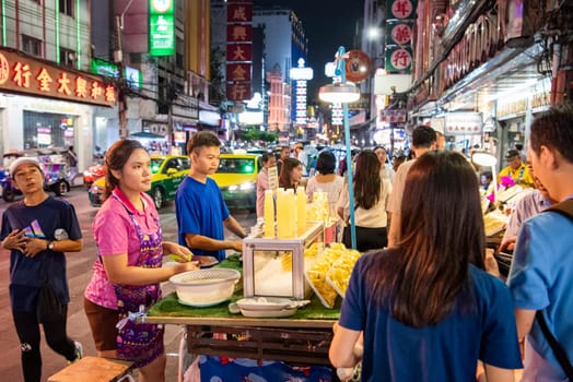 People and shops at Night Streetmarket on Yaowarat Road in Chinatown in City of Bangkok in Thailand.  Thailand, Bangkok, November, 4, 2024.