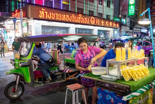 People and shops at Night Streetmarket on Yaowarat Road in Chinatown in City of Bangkok in Thailand.  Thailand, Bangkok, November, 4, 2024.