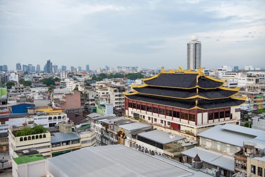 Wat Chaiyaphum Karam in China Town with skyline of City of Bangkok in Thailand.  Thailand, Bangkok, November, 5, 2024.