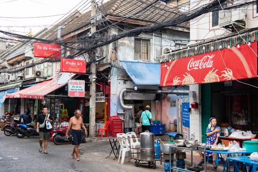 a street with shops and Market the China Town with skyline in the City of Bangkok in Thailand.  Thailand, Bangkok, November, 5, 2024.