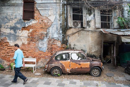 a old car in a alley in Talat Noi at China Town in City of Bangkok in Thailand.  Thailand, Bangkok, November, 5, 2024.