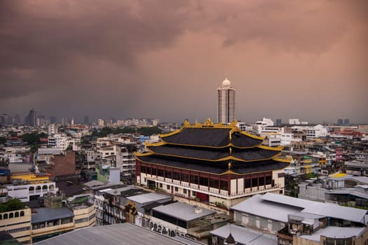 Wat Chaiyaphum Karam in China Town with skyline of City of Bangkok in Thailand.  Thailand, Bangkok, November, 5, 2024.